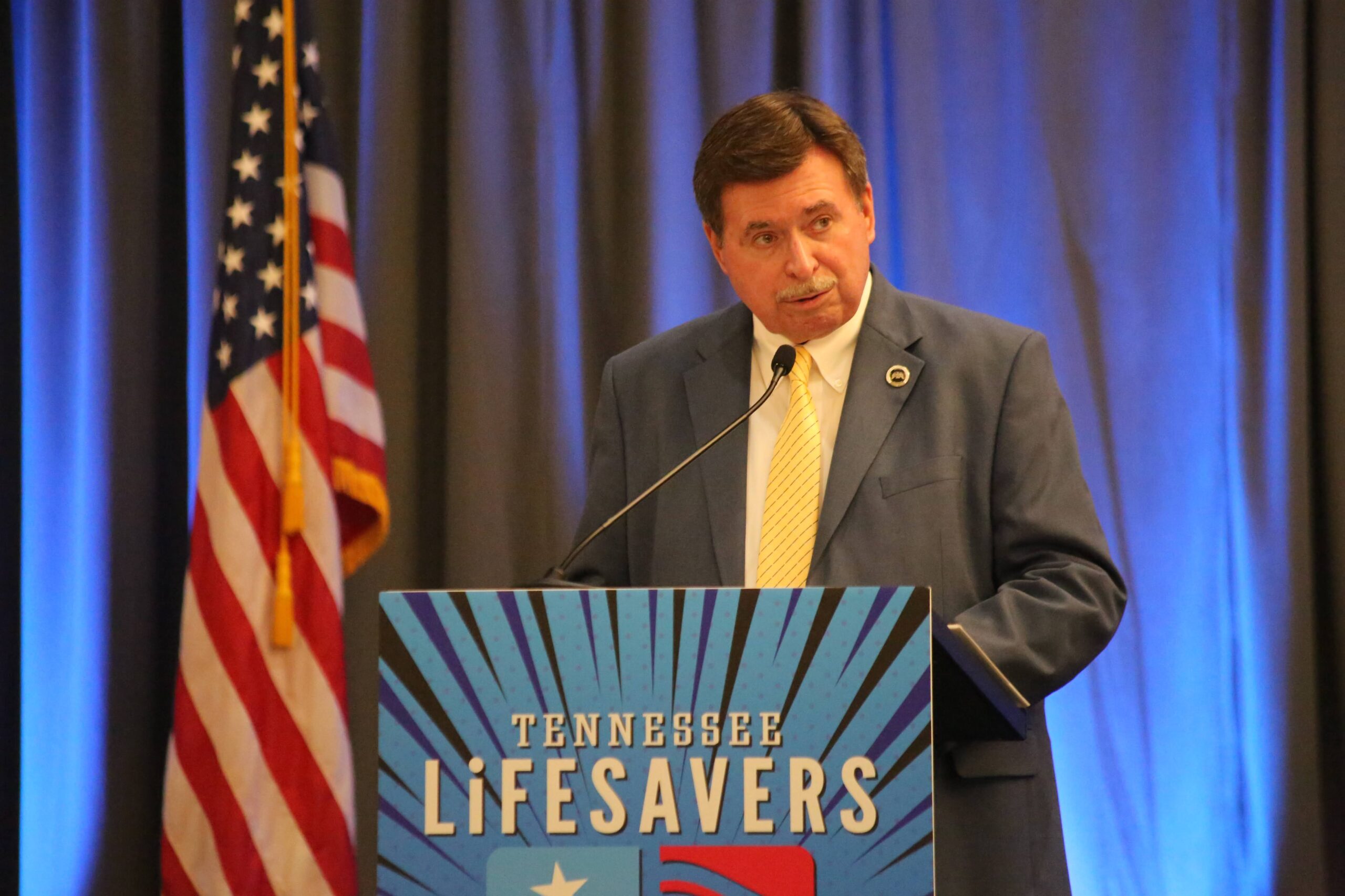 Director Buddy Lewis speaking at Opening Session